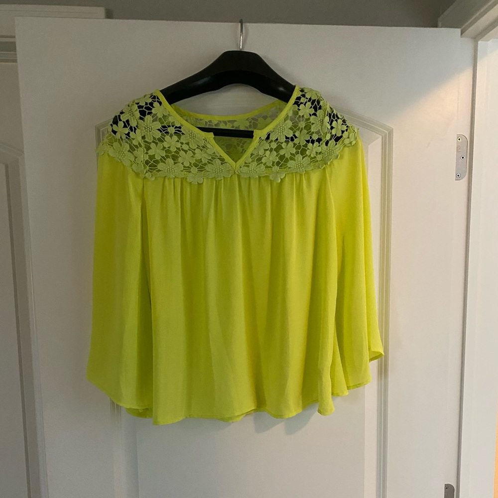 Bright yellow blouse.